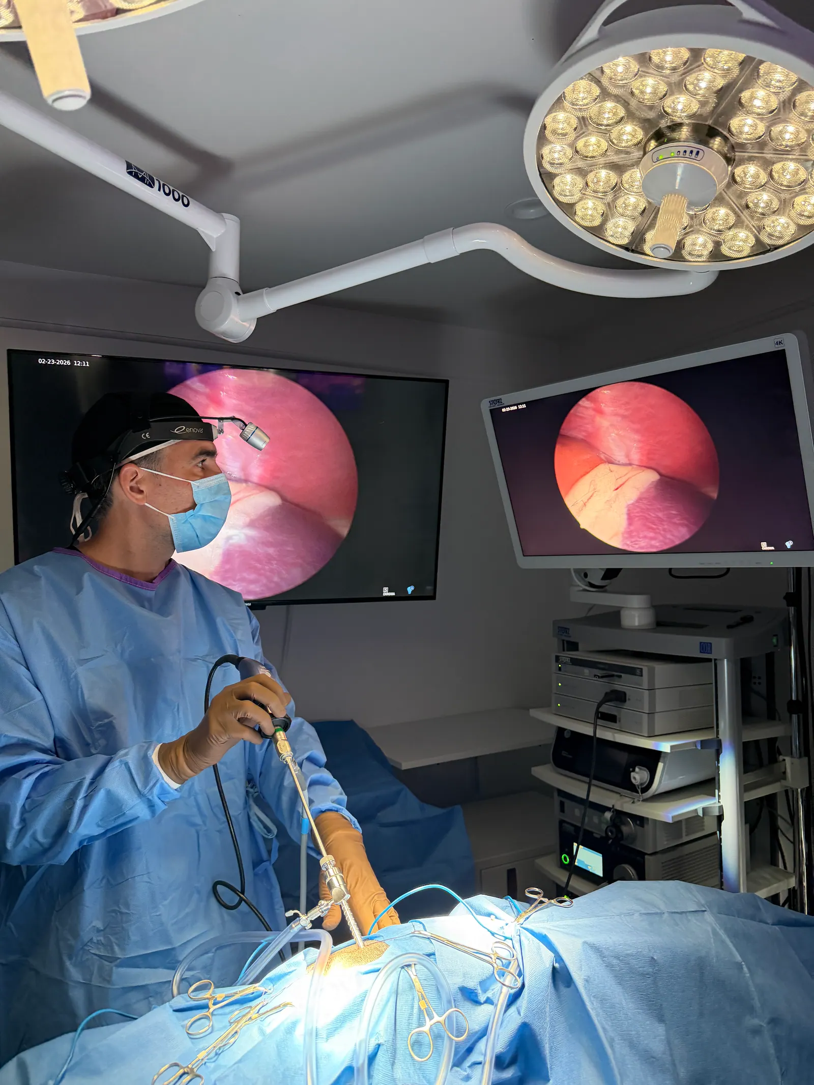 Operating team coordinated around the HD monitor during surgery